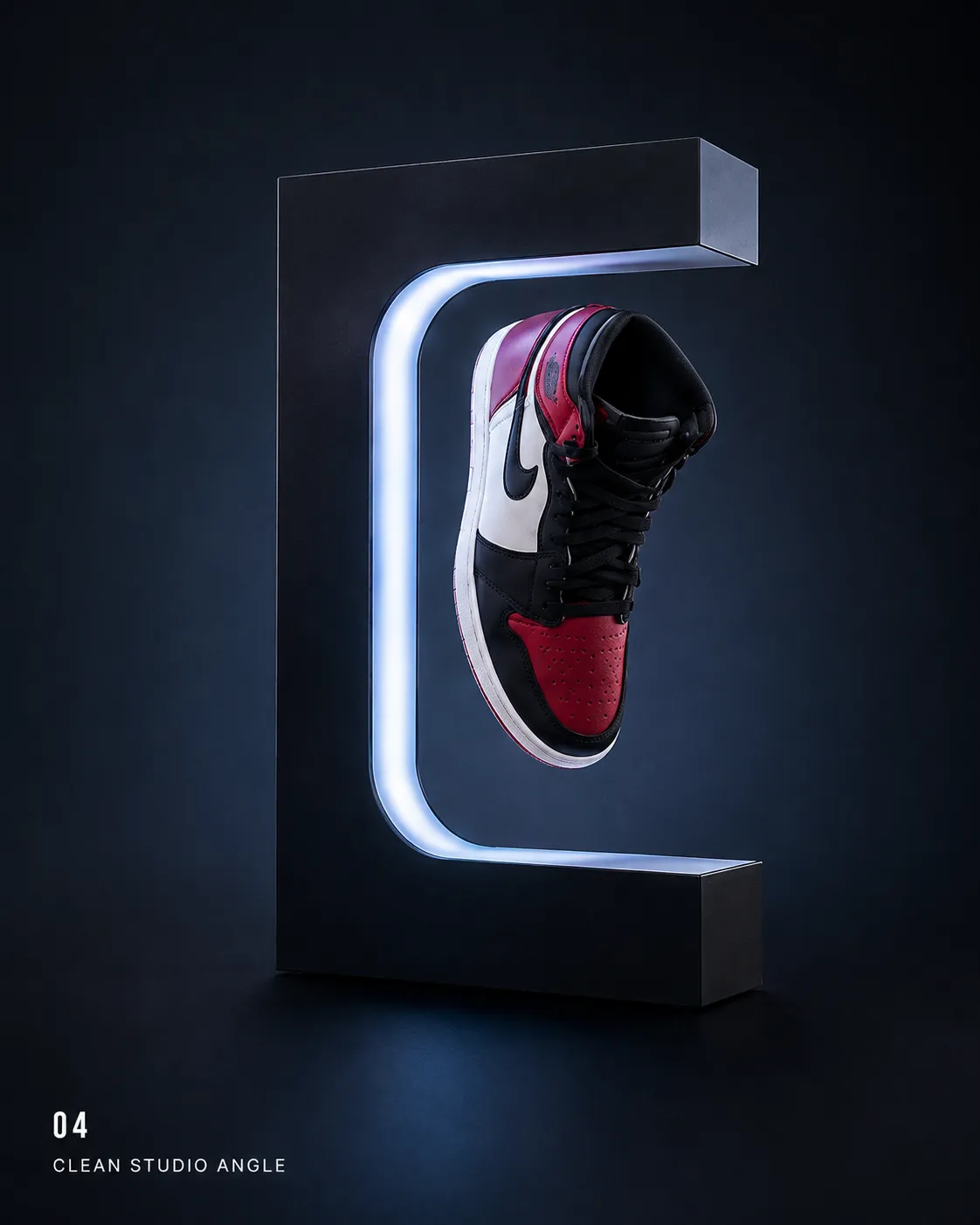 LEVITAS One — the black frame with a sneaker locked in the float, clean dark studio
